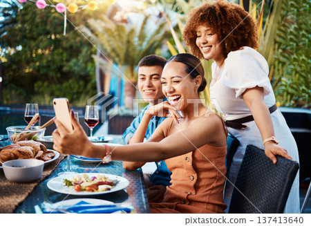 Friends, food and selfie at outdoor table for holiday, Christmas or thanksgiving on social media. Young women, man or group with photography or influencer profile picture for happy brunch celebration 137413640
