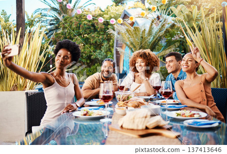 Friends in selfie at lunch in garden, food and wine at happy event with diversity in outdoor bonding together. Photography, men and women at dinner party table, people eating with drinks in backyard. Friends in selfie at lunch in garden, food and wine at happy event with diversity in outdoor bonding together. Photography, men and women at dinner party table, people eating with drinks in backyard. 137413646