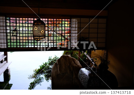 Hanging lanterns and water basin at Sankeien Garden Hanging lanterns and water basin at Sankeien Garden 137413718