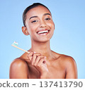 Portrait, woman and brushing teeth in studio for dental wellness, care and healthy smile on blue background. Happy indian model, bamboo toothbrush and cleaning mouth for oral hygiene of fresh breath 137413790