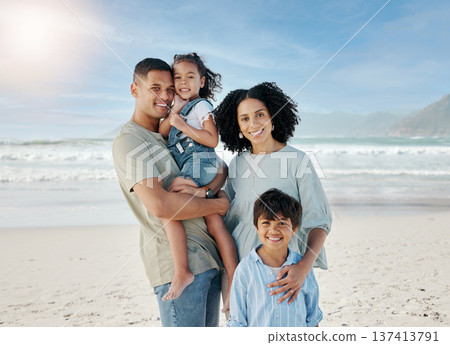 Mom, dad and children in portrait, ocean and happy with hug, love and bonding on vacation in summer sunshine. Parents, kids and smile together at beach, holiday and outdoor by sea, waves and sand Mom, dad and children in portrait, ocean and happy with hug, love and bonding on vacation in summer sunshine. Parents, kids and smile together at beach, holiday and outdoor by sea, waves and sand 137413791