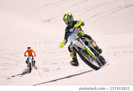 Dune, race and men on motorbike together for practice, training and extreme sports energy in nature. Professional dirt biking challenge, friends and danger with motorcycle competition on desert hill. Dune, race and men on motorbike together for practice, training and extreme sports energy in nature. Professional dirt biking challenge, friends and danger with motorcycle competition on desert hill. 137413831