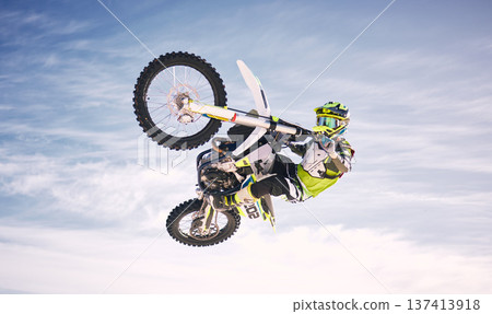 Sky, jump and man on off road motorbike for practice, training and extreme sports energy in nature. Professional dirt biking adventure challenge, person in clouds and danger in motorcycle competition Sky, jump and man on off road motorbike for practice, training and extreme sports energy in nature. Professional dirt biking adventure challenge, person in clouds and danger in motorcycle competition 137413918