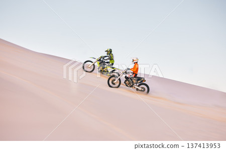 Dune, off road race and men on motorbike together for practice, training and extreme sports energy. Professional dirt biking challenge, friends and danger with motorcycle competition on desert hill. Dune, off road race and men on motorbike together for practice, training and extreme sports energy. Professional dirt biking challenge, friends and danger with motorcycle competition on desert hill. 137413953