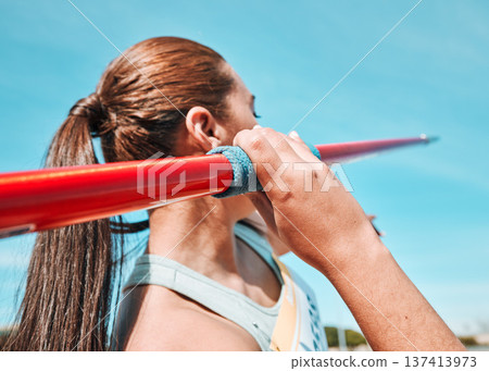 Woman, javelin and athlete in sports competition, practice or training in fitness on stadium field. Active female person or athletic competitor throwing spear, poll or stick in distance 137413973