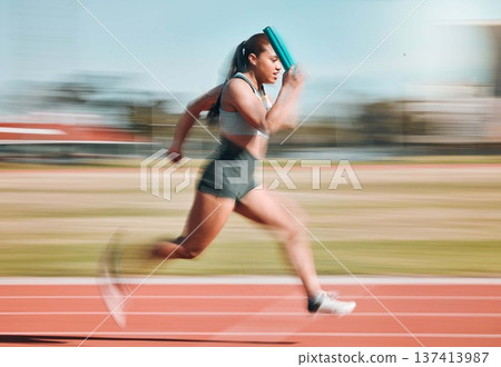 Action, speed and woman athlete running relay sprint in competition for fitness game and training for energy wellness on a track. Sports, stadium and athletic person or runner exercise and workout 137413987