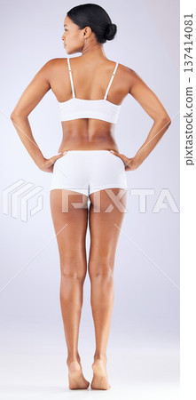 Beauty, underwear and back of woman in a studio with wellness, health and weightloss routine. Fitness, body and full length of female model with cosmetic liposuction for self care by white background Beauty, underwear and back of woman in a studio with wellness, health and weightloss routine. Fitness, body and full length of female model with cosmetic liposuction for self care by white background 137414081