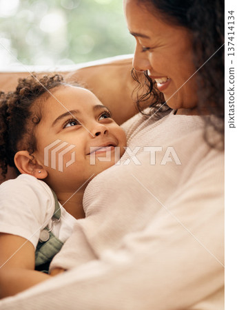 Love, woman and child embrace on sofa, bonding and smile together in living room of home. Relax, hug and happy relationship with mother and daughter on couch with care, support and security in lounge Love, woman and child embrace on sofa, bonding and smile together in living room of home. Relax, hug and happy relationship with mother and daughter on couch with care, support and security in lounge 137414134