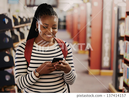 Student, reading and woman in library with phone for research, information or browsing internet, website or social media. College, campus and girl typing on smartphone for info communication or chat 137414157