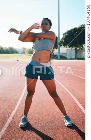 Woman, sports and exercise or stretching outdoor on a track for running, training or workout. African athlete person at stadium for arm stretch, fitness and muscle warm up or body wellness Woman, sports and exercise or stretching outdoor on a track for running, training or workout. African athlete person at stadium for arm stretch, fitness and muscle warm up or body wellness 137414159