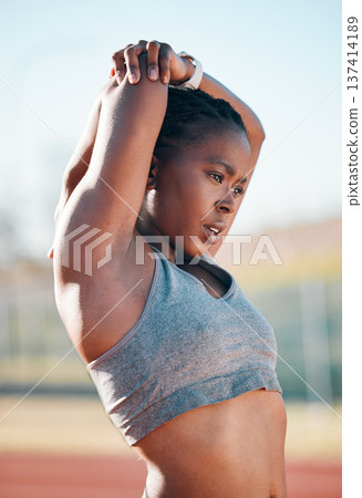 Sports, exercise and woman stretching outdoor at a stadium for workout, training and warm up. African athlete person for muscle stretch, fitness and wellness or flexibility for a run or competition Sports, exercise and woman stretching outdoor at a stadium for workout, training and warm up. African athlete person for muscle stretch, fitness and wellness or flexibility for a run or competition 137414189