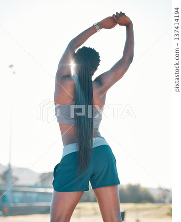 Stretching, exercise and sports woman outdoor at a stadium for workout, training and warm up. Back of athlete person for muscle stretch, fitness and wellness or flexibility for a run or competition Stretching, exercise and sports woman outdoor at a stadium for workout, training and warm up. Back of athlete person for muscle stretch, fitness and wellness or flexibility for a run or competition 137414194