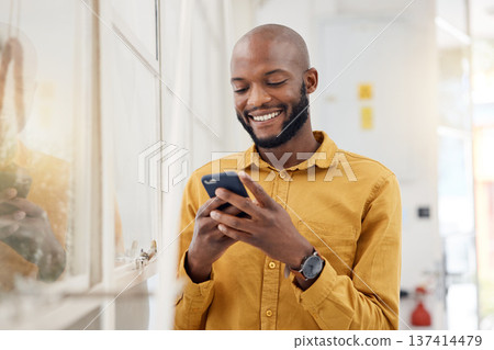 Happy black man, smartphone and typing in office for social media, networking and mobile contact. Business employee smile with cellphone, reading tech notification and information on digital news app Happy black man, smartphone and typing in office for social media, networking and mobile contact. Business employee smile with cellphone, reading tech notification and information on digital news app 137414479