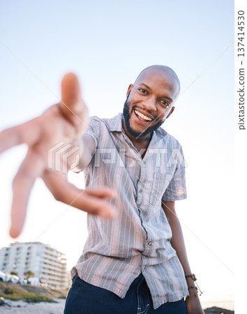 Portrait, happy black man and helping hand, offer and invitation outdoor in low angle mockup. Smile, palm and African person giving assistance in support, care and acceptance of handshake to welcome 137414530