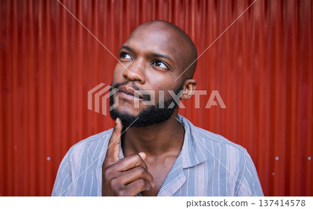Thinking, outdoor and black man with ideas, solution and problem solving against a red wall background. African person, guy and model with wonder, doubt and fantasy with thoughts, question and choice Thinking, outdoor and black man with ideas, solution and problem solving against a red wall background. African person, guy and model with wonder, doubt and fantasy with thoughts, question and choice 137414578