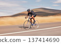 Speed, nature and road, man on bicycle for workout, exercise and scenic mountain path. Health, wellness and cyclist on bike for morning training, practice and cycling race, blue sky and fast motion. 137414690