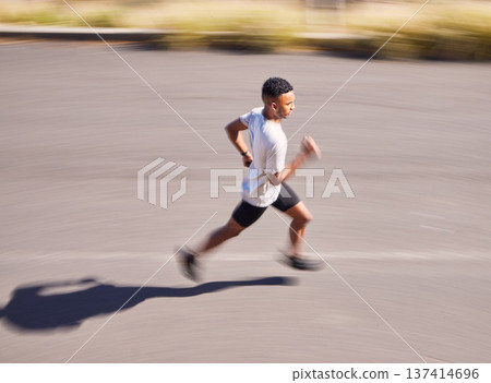Health, running and motion blur with a sports man on a road for his cardio or endurance workout from above. Exercise, fitness and a runner training for a marathon in the mountains during summer 137414696