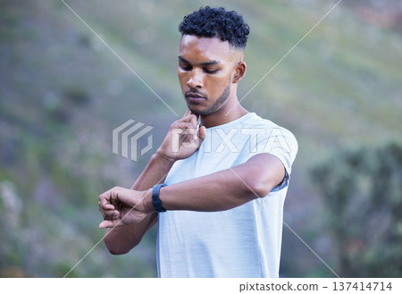 Fitness, exercise and man with watch for pulse outdoor to check progress on run, workout or training. Indian athlete person or runner in nature for sports performance, cardio time and wellness app 137414714