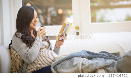 Asian, pregnant woman and reading book with fruit in home for maternity, guidance and nutrition. Person, snack and pregnancy novel for prenatal tips, childbirth information and motherhood in lounge Asian, pregnant woman and reading book with fruit in home for maternity, guidance and nutrition. Person, snack and pregnancy novel for prenatal tips, childbirth information and motherhood in lounge 137414721