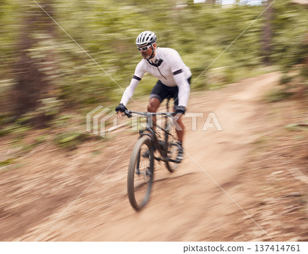 Cycling, fitness and man with bicycle in a forest for speed, training or workout in nature for off road hobby. Extreme sports, mountain bike and cyclist in woods for workout or adrenaline performance 137414761