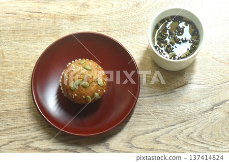 butter banana cake topping peanut and whole grain on plate with hot Chinese tea cup 137414824