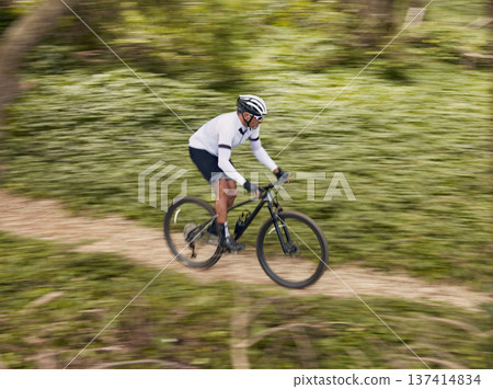 Cycling, fitness and man with mountain bike in forest for speed, training or nature workout with top view off road race. Extreme sports, bicycle or cyclist in woods for workout, performance or ride Cycling, fitness and man with mountain bike in forest for speed, training or nature workout with top view off road race. Extreme sports, bicycle or cyclist in woods for workout, performance or ride 137414834