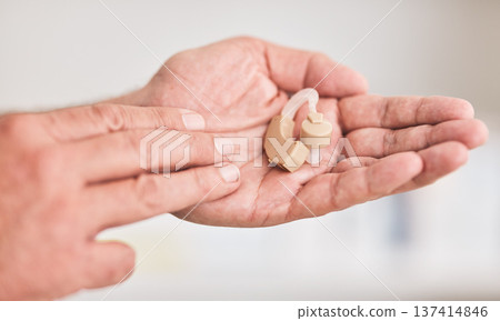 Hearing aid, hands and person with disability for listening, healthcare support or medical innovation. Closeup of deaf patient with audiology implant for sound waves, amplifier or help improve volume 137414846