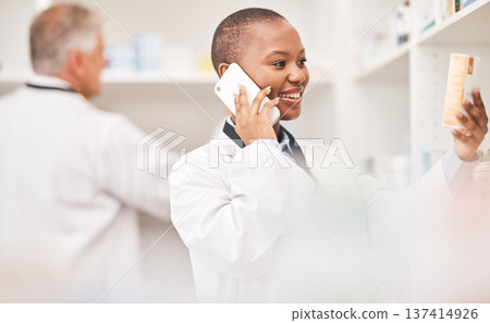 Pharmacy, phone call and woman with medicine box while reading information. African person or pharmacist talking on smartphone for telehealth, consultation or customer service and product label Pharmacy, phone call and woman with medicine box while reading information. African person or pharmacist talking on smartphone for telehealth, consultation or customer service and product label 137414926