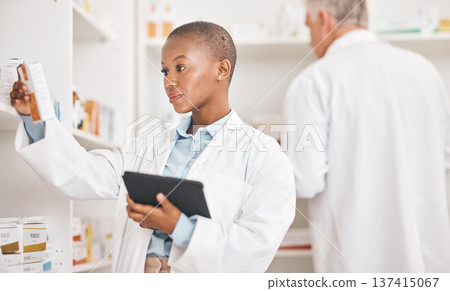 Healthcare, pharmacy or black woman with a tablet, connection or research on medication or pill box for treatment. Medical, pharmaceutical or African person with tech, drugstore or check prescription 137415067
