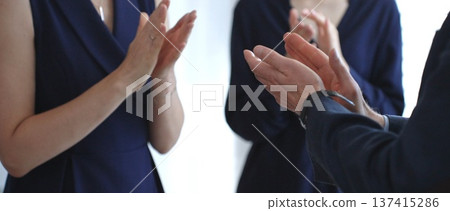 Business people clapping hands, showing support and appreciation for achievements, success, and accomplishment during a company meeting or presentation Business people clapping hands, showing support and appreciation for achievements, success, and accomplishment during a company meeting or presentation 137415286