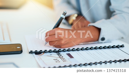 Closeup man hands filling in company paperwork. Professional individual finalizing business documents, step by step approach. Completing contract forms for new employees at the office. 137415318