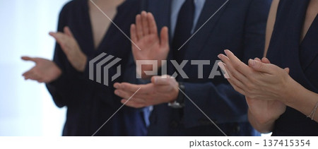 Businesspeople applauding, showing appreciation and celebrating success during a corporate event, conference, or team meeting in an office environment. Business people concept Businesspeople applauding, showing appreciation and celebrating success during a corporate event, conference, or team meeting in an office environment. Business people concept 137415354