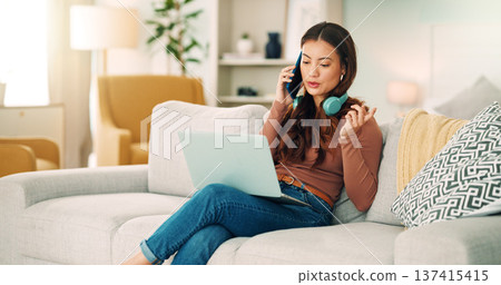 Girl, phone and call on sofa happy talking, headphones and smile, with laptop for online job in house. Woman, smartphone and conversation on couch, communication and computer for remote work in home Girl, phone and call on sofa happy talking, headphones and smile, with laptop for online job in house. Woman, smartphone and conversation on couch, communication and computer for remote work in home 137415415