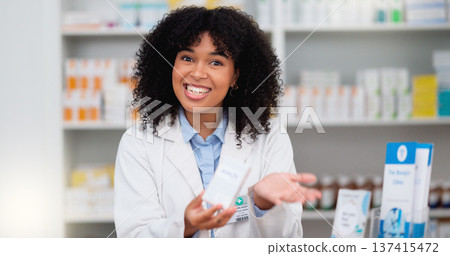 Friendly female chemist explaining the benefits of medicine. African American woman pharmacist listening to the symptoms of the customer. Health worker recommending a specific product to the client Friendly female chemist explaining the benefits of medicine. African American woman pharmacist listening to the symptoms of the customer. Health worker recommending a specific product to the client 137415472