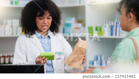 Concerned pharmacist assisting an upset and angry customer in a local pharmacy. Female client returning medication and complaining about an allergic reaction after taking prescription medicine Concerned pharmacist assisting an upset and angry customer in a local pharmacy. Female client returning medication and complaining about an allergic reaction after taking prescription medicine 137415481