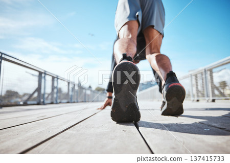 Fitness, running and a the back of a man at the start of his workout in the city for cardio or endurance training. Exercise, bridge and shoes of a male runner or athlete outdoor for a challenge Fitness, running and a the back of a man at the start of his workout in the city for cardio or endurance training. Exercise, bridge and shoes of a male runner or athlete outdoor for a challenge 137415733