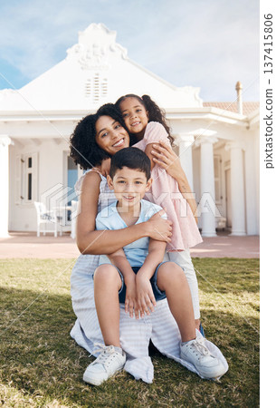 Portrait, love and children with a family in the backyard of their home together during summer. Smile, happy mother and real estate on the lawn in the garden of their new house for trust or care 137415806