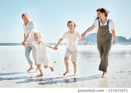 Happy family, holding hands and playing on beach in holiday, weekend or outdoor bonding together. Father, mother and children smile in happiness for summer vacation or fun on ocean coast in nature 137415971