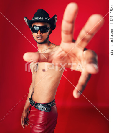 Man, portrait and fashion with grunge in studio or red background with unique cowboy aesthetic and sunglasses. Gen z, style and model with pride and hand in photography, retro or western clothing Man, portrait and fashion with grunge in studio or red background with unique cowboy aesthetic and sunglasses. Gen z, style and model with pride and hand in photography, retro or western clothing 137415982