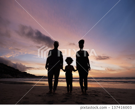 Shadow, family at beach and holding hands at sunset, bonding or outdoor on mockup space. Silhouette, sea and father, kid and mother at ocean in care, summer holiday and vacation to travel together Shadow, family at beach and holding hands at sunset, bonding or outdoor on mockup space. Silhouette, sea and father, kid and mother at ocean in care, summer holiday and vacation to travel together 137416003