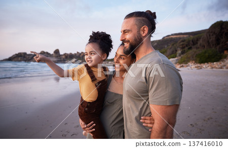 Child, pointing and happy family on beach at sunset on summer, vacation or bonding together on tropical holiday in Costa Rica. Ocean, view and interracial parents support girl or kid show with hand 137416010
