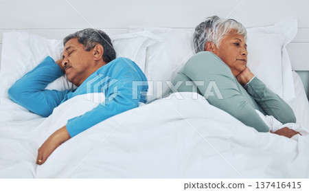 Sleeping, fighting and a senior couple in a bed with insomnia in a marriage together. Conflict, tired and elderly man and woman in the bedroom for rest in divorce and a nap with thinking in a house Sleeping, fighting and a senior couple in a bed with insomnia in a marriage together. Conflict, tired and elderly man and woman in the bedroom for rest in divorce and a nap with thinking in a house 137416415