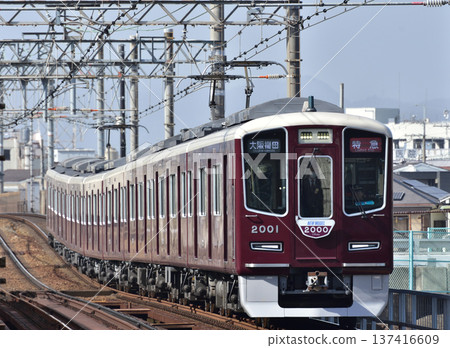 Hankyu Kobe Line 2000 series train passing through Kanzakigawa Station Hankyu Kobe Line 2000 series train passing through Kanzakigawa Station 137416609