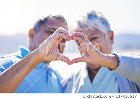 Heart, hands and senior couple at a beach with love, care and trust while bonding in nature together. Emoji, finger and old people with thank you, support or sign of kindness, hope or freedom at sea Heart, hands and senior couple at a beach with love, care and trust while bonding in nature together. Emoji, finger and old people with thank you, support or sign of kindness, hope or freedom at sea 137416617