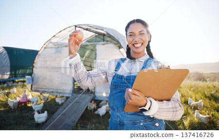 Farm, poultry and a woman with an egg for inspection and a clipboard for quality control. Chicken farming, sustainability and portrait of farmer person with organic produce outdoor for agriculture Farm, poultry and a woman with an egg for inspection and a clipboard for quality control. Chicken farming, sustainability and portrait of farmer person with organic produce outdoor for agriculture 137416726
