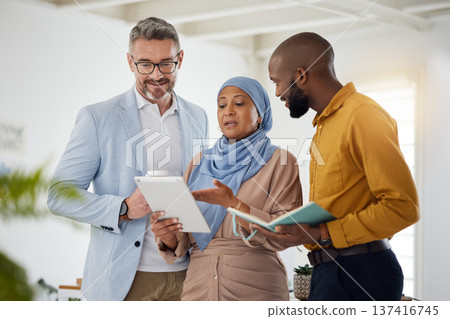 Business people, teamwork and manager on tablet for marketing, website design and management in office. Diversity of men and woman on digital tech for brainstorming, planning or project collaboration Business people, teamwork and manager on tablet for marketing, website design and management in office. Diversity of men and woman on digital tech for brainstorming, planning or project collaboration 137416745