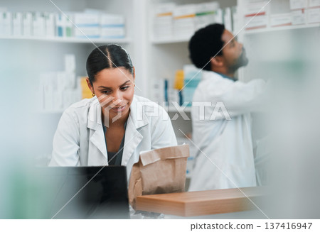 Woman, pharmacist and team in inventory inspection or checking stock or medication at the pharmacy. People, medical or healthcare professional looking at pharmaceuticals together at the drugstore Woman, pharmacist and team in inventory inspection or checking stock or medication at the pharmacy. People, medical or healthcare professional looking at pharmaceuticals together at the drugstore 137416947