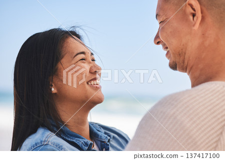 Happy, couple and love at the beach together for travel, date or a vacation in the summer. Smile, marriage and a man and woman with care on a holiday, the sea for a honeymoon or outdoor walking Happy, couple and love at the beach together for travel, date or a vacation in the summer. Smile, marriage and a man and woman with care on a holiday, the sea for a honeymoon or outdoor walking 137417100