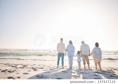 Summer, space and holding hands with big family on beach for vacation, bonding and love. Freedom, care and relax with group of people walking at seaside holiday for generations, happiness and mockup Summer, space and holding hands with big family on beach for vacation, bonding and love. Freedom, care and relax with group of people walking at seaside holiday for generations, happiness and mockup 137417114