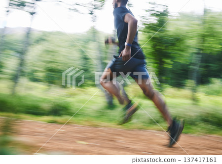 Sports man, speed and running in forest with motion blur, cardio workout and exercise action. Runner, fast athlete and training for marathon challenge with energy, dynamic fitness and power in park Sports man, speed and running in forest with motion blur, cardio workout and exercise action. Runner, fast athlete and training for marathon challenge with energy, dynamic fitness and power in park 137417161